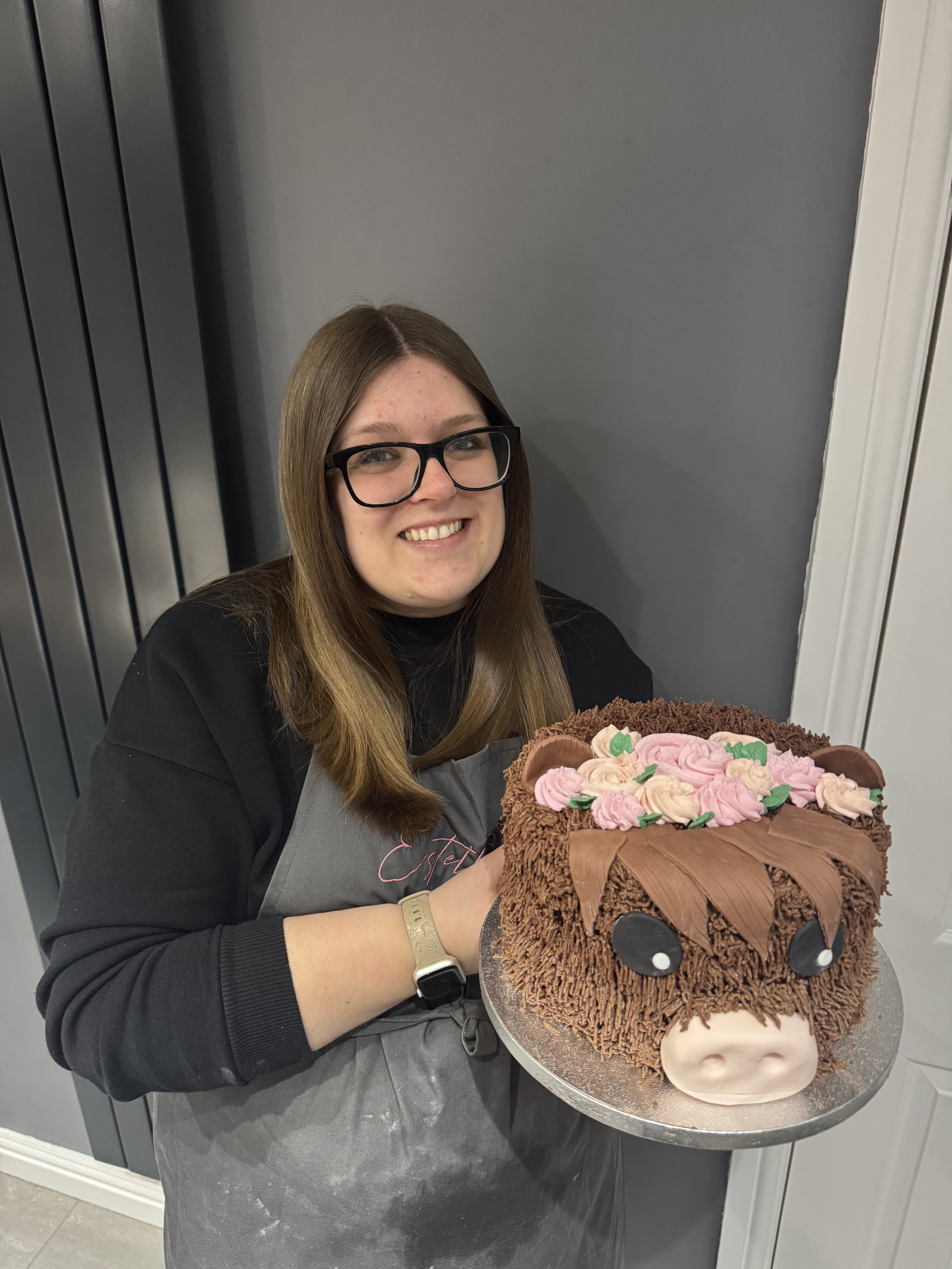 Estelle holding cake
